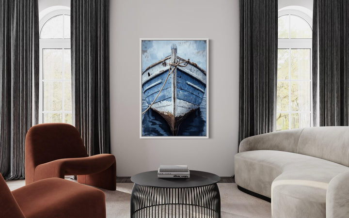 Vertical canvas wall art of a rustic blue boat close-up in a modern living room setting.