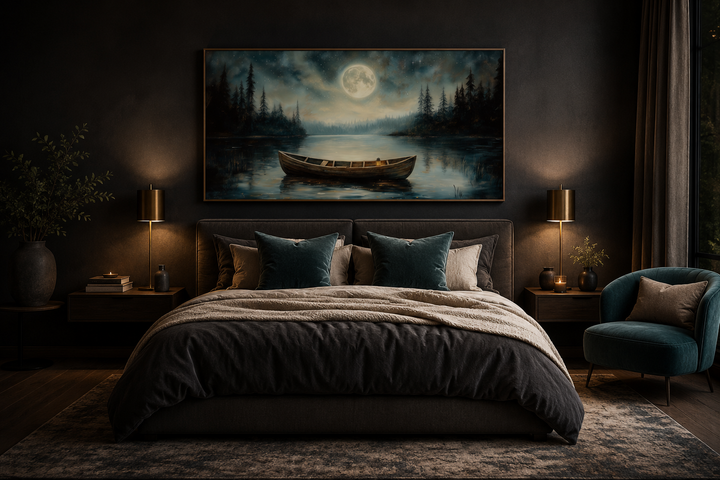 Framed canvas art of a wooden boat on a lake under a full moon, hanging above a bed in a dark room.