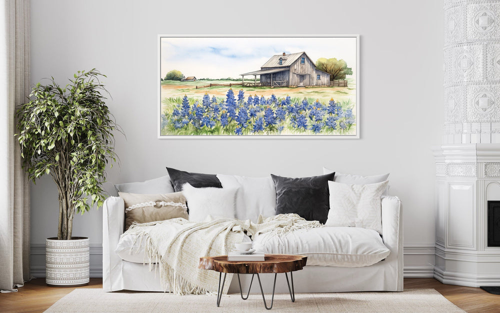 Old Farm Barn And Bluebonnets Field Texas Framed Canvas Wall Art hanging over white modern couch