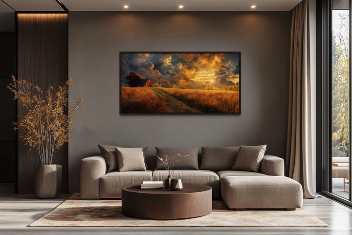 Old red barn in autumn sunset framed farmhouse canvas wall art above a modern sofa.