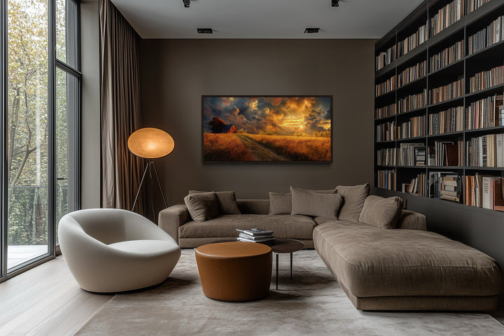 Old red barn in autumn sunset framed farmhouse canvas wall art hanging in a modern living room.