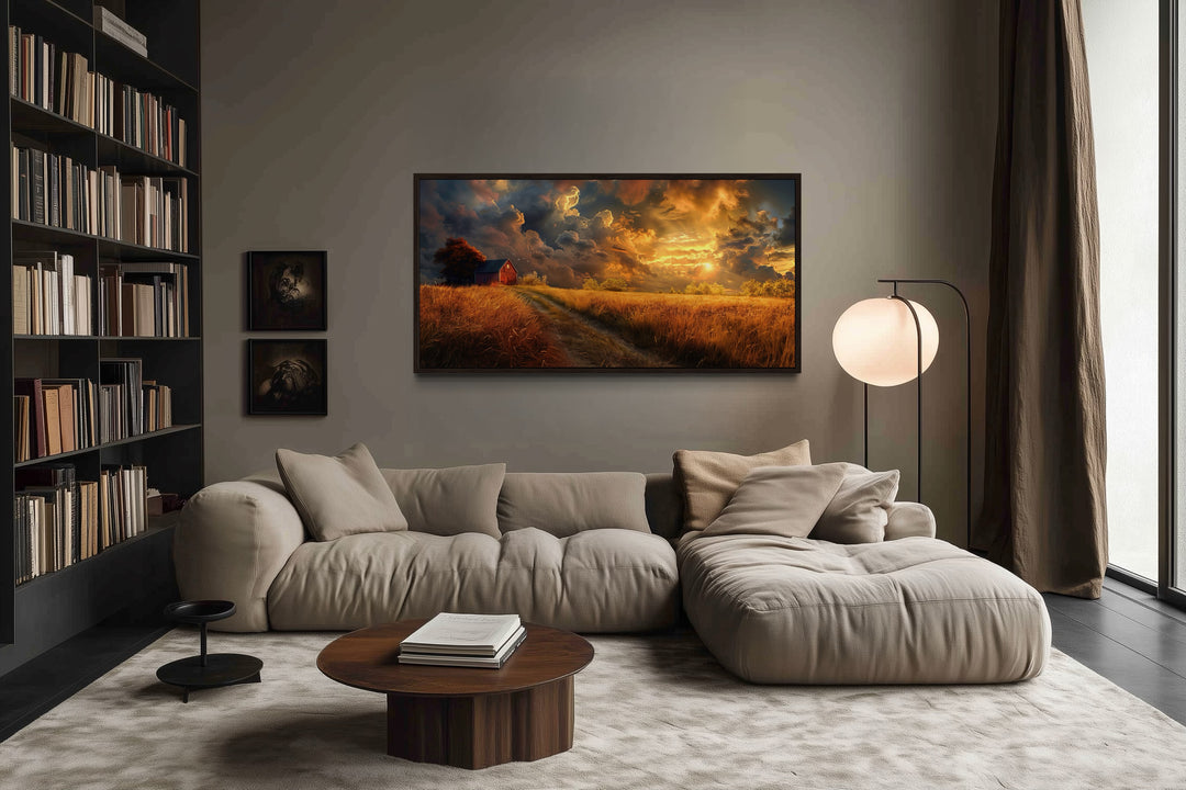 Old red barn in autumn sunset framed farmhouse canvas wall art hanging in a modern living room.