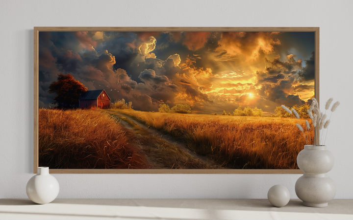 Old red barn in autumn sunset framed farmhouse canvas wall art above a console with ceramic vases.