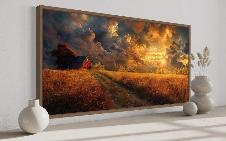Old red barn in autumn sunset framed farmhouse canvas wall art displayed in a modern room.