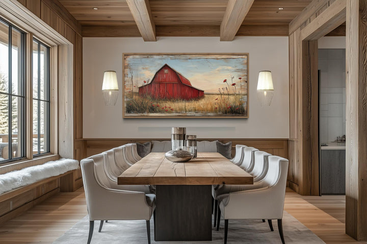 Old red barn on weathered wood canvas wall art hanging in a rustic farmhouse dining room.
