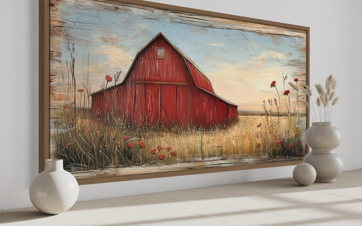 Old red barn on weathered wood canvas wall art in a rustic farmhouse living room setting.