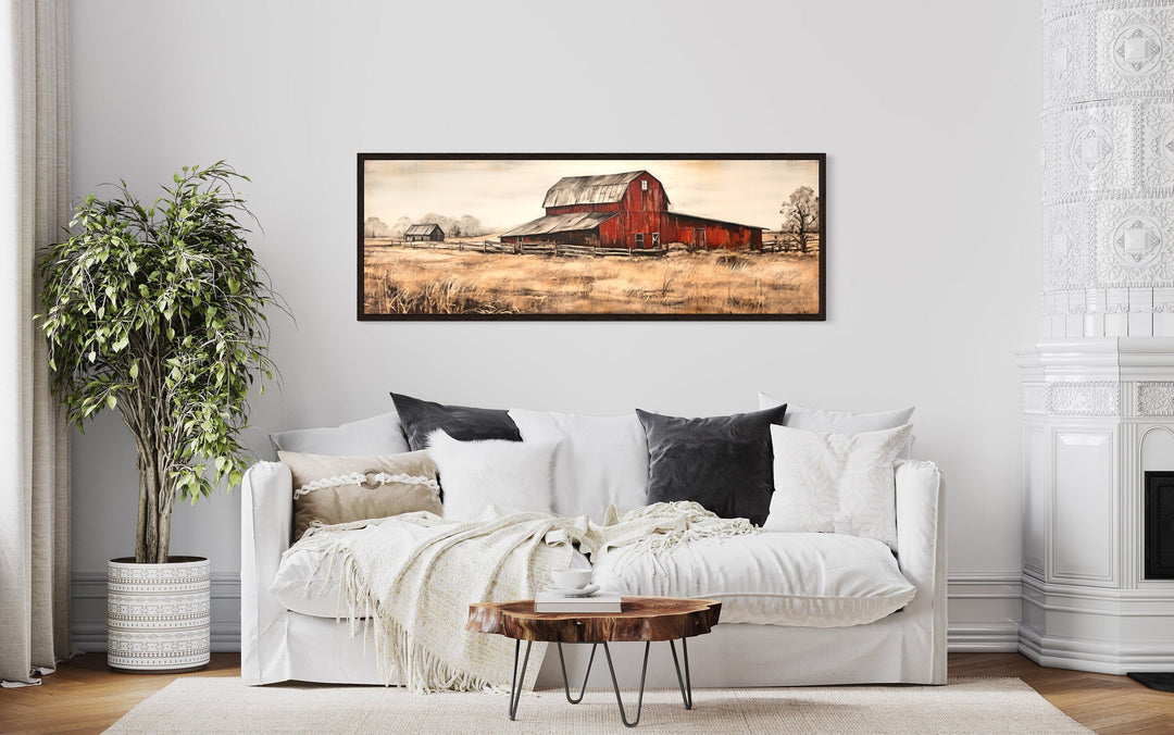 Horizontal framed canvas art of a rustic red barn in a field.