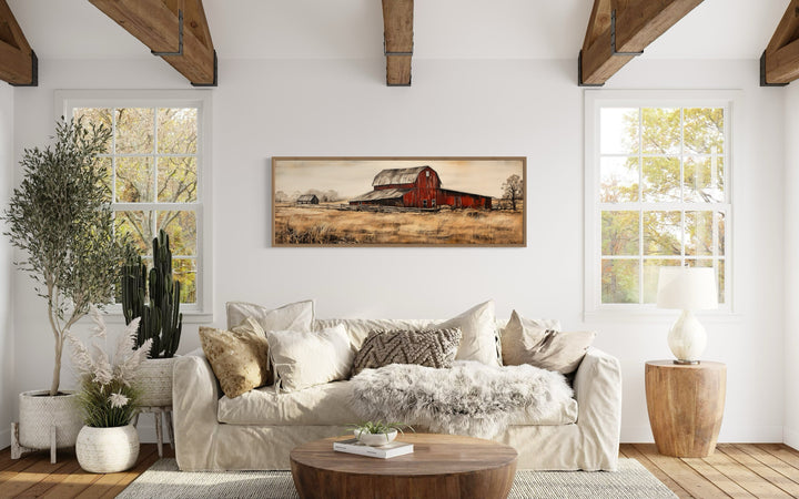 Horizontal framed canvas painting of an old red barn in a rustic landscape.