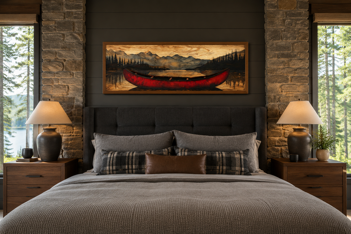 Old red canoe painted on wood long horizontal framed canvas wall art hanging above a bed.