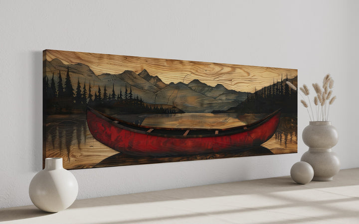 Old red canoe painted on wood long horizontal framed canvas wall art in a modern room setting.