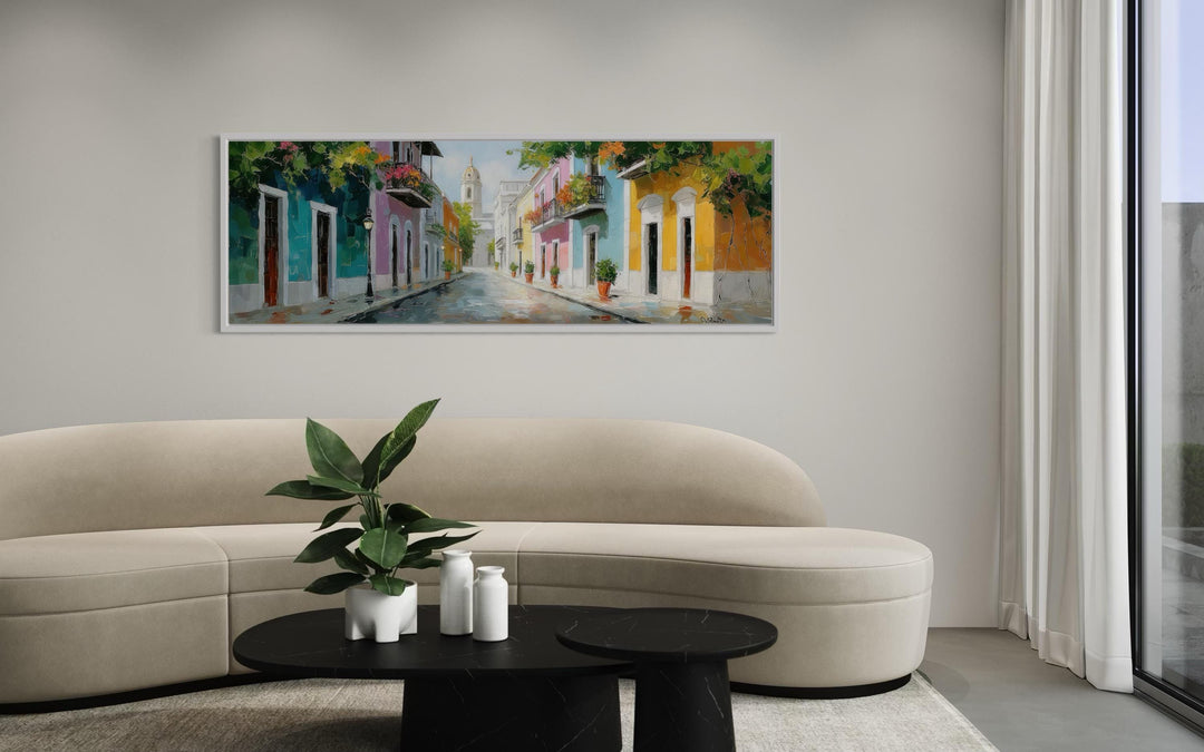 Old San Juan Street Puerto Rico long horizontal wall art above a modern curved sofa.