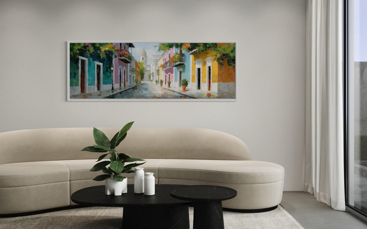 Old San Juan Street Puerto Rico long horizontal wall art above a modern curved sofa.
