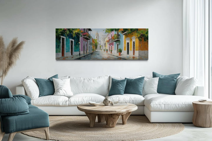 Old San Juan Street Puerto Rico long horizontal wall art above a white sofa in a living room.