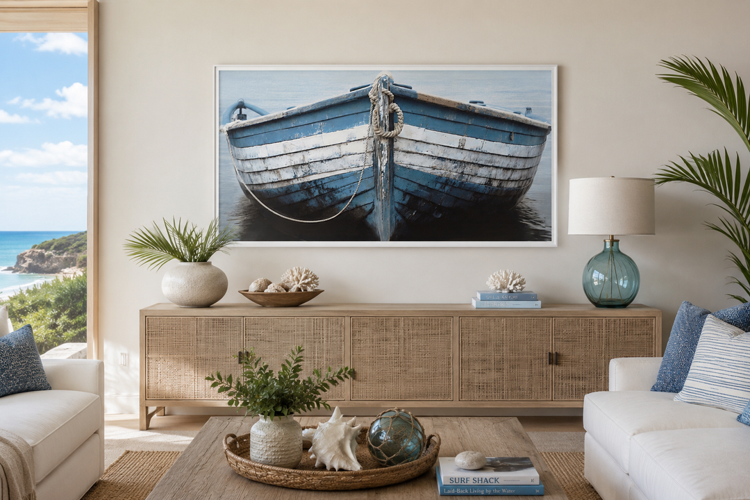 Rustic blue and white boat canvas wall art hanging above a wooden console in a coastal living room.