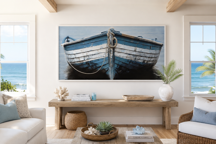 Rustic blue and white boat canvas wall art hanging in a coastal living room above a wooden bench.