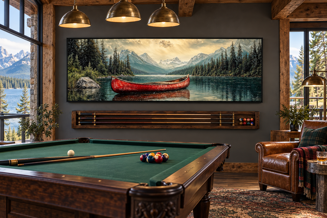 Rustic framed canvas wall art of an old red canoe on a mountain lake above a pool table.