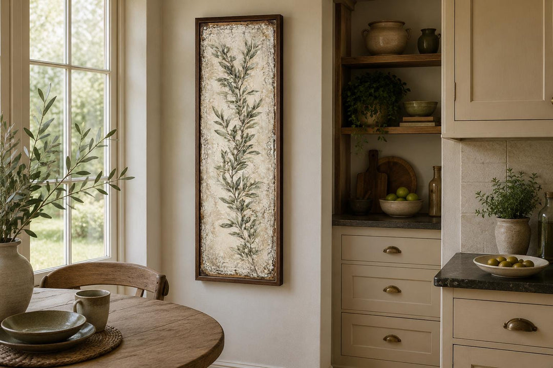 Tall vertical canvas wall art featuring a painted olive branch in a rustic wooden frame.