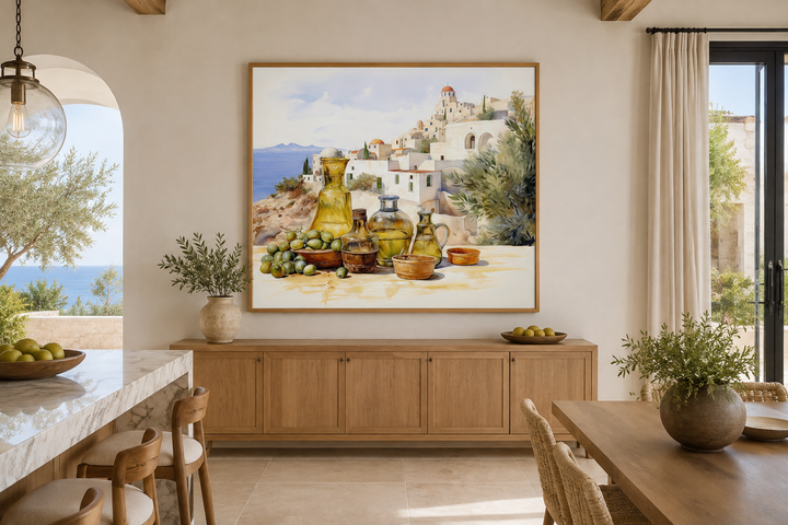 Framed watercolor canvas of a Greek landscape with olives and oil bottles in a modern kitchen.