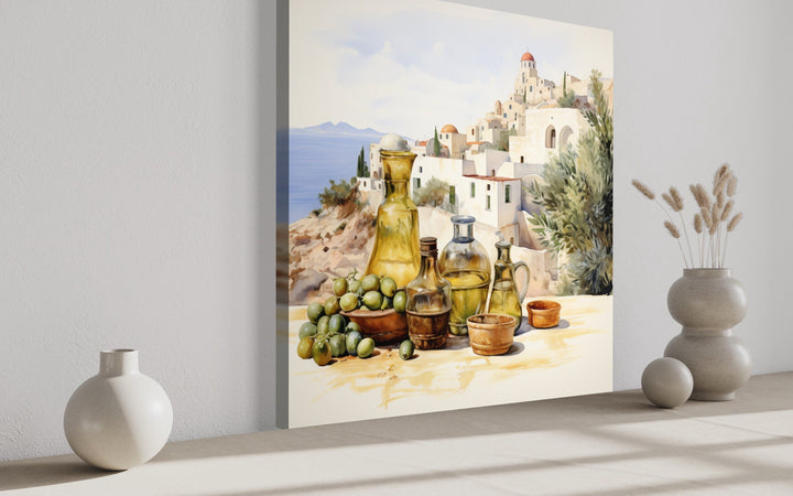 Watercolor canvas art of olives, oil bottles, and a Greek village landscape for kitchen decor.