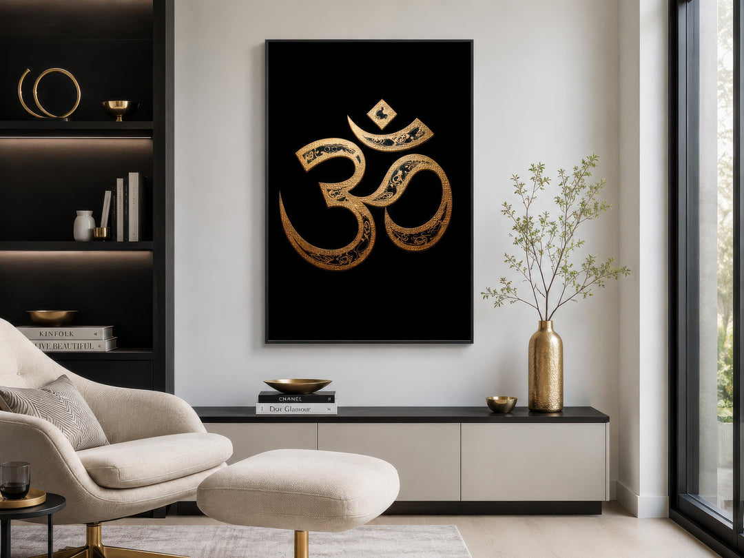 Gold and black Om symbol canvas wall art displayed in a modern, minimalist living room.