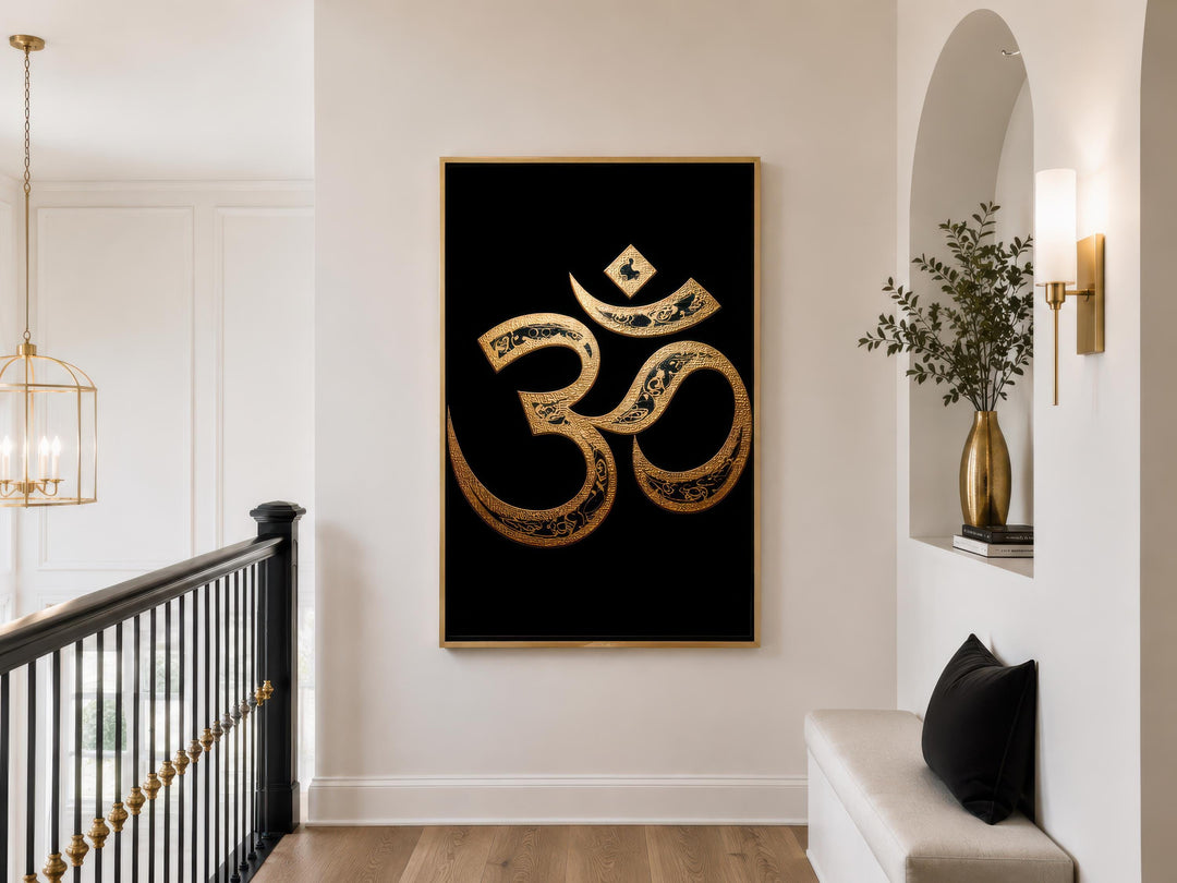 A large gold and black Om symbol canvas print hangs in a modern, minimalist hallway.