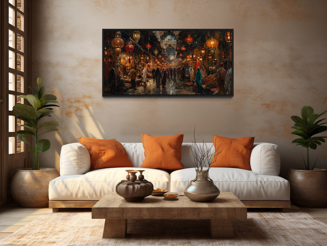 Oriental bazaar framed canvas wall art hanging above a white sofa in a rustic living room.