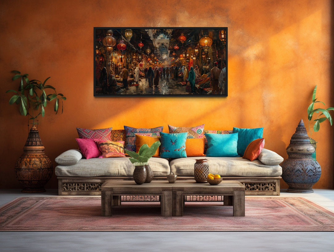 Oriental Bazaar framed wall art above a rustic sofa with colorful pillows and a wooden coffee table.