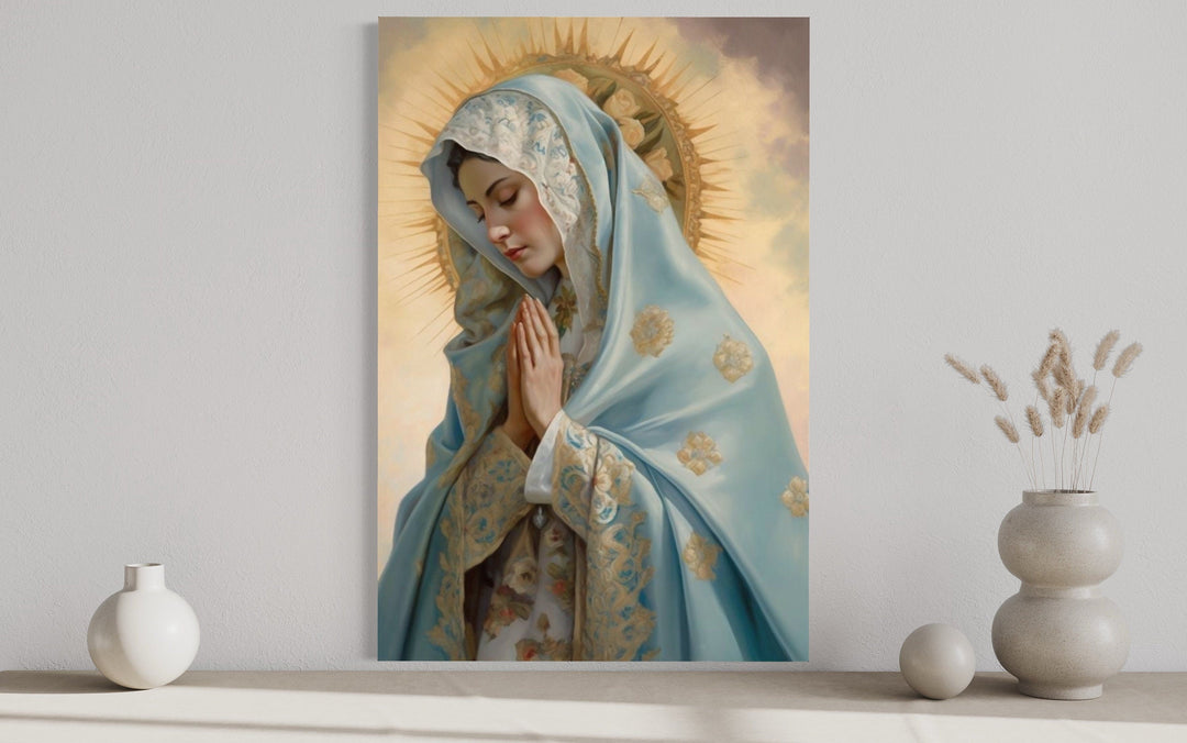 Our Lady of Guadalupe framed canvas wall art depicting the Virgin Mary in prayer on a neutral wall.
