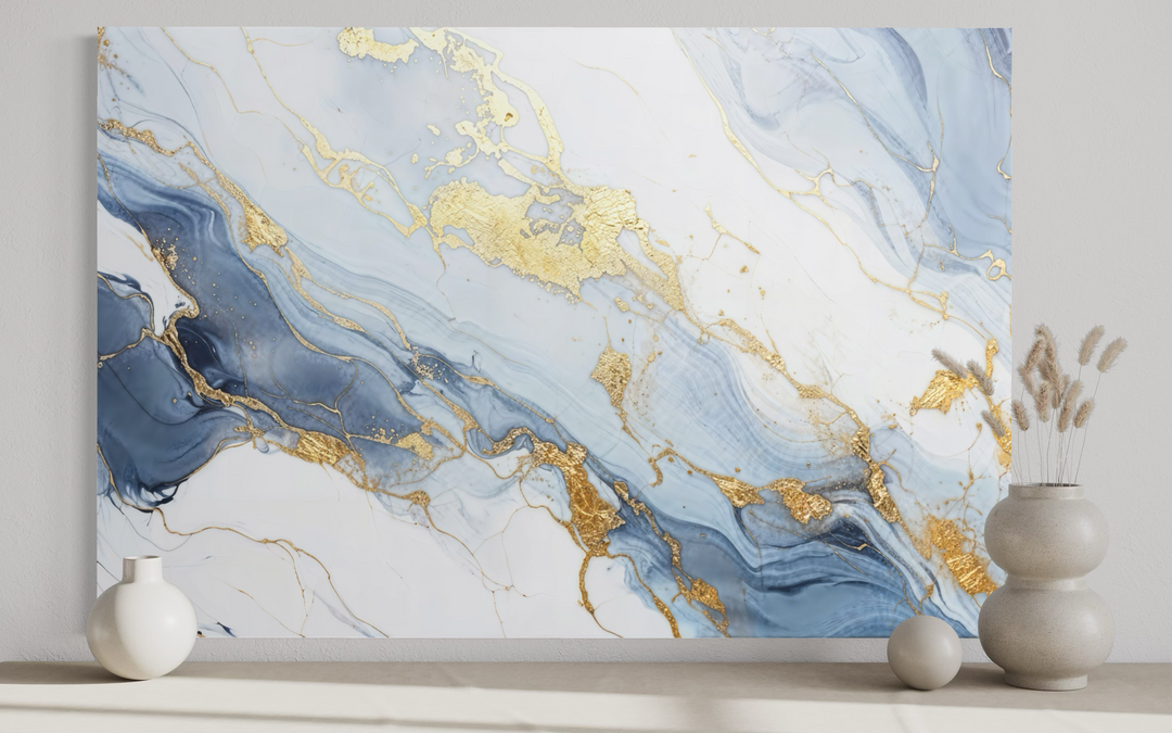 Pale blue, grey, and gold abstract marble canvas wall art displayed above a shelf with vases.