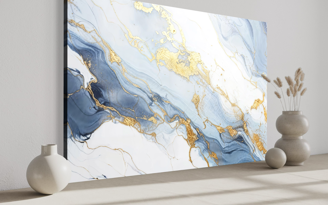 Abstract marble canvas wall art with pale blue, grey, and gold flowing patterns in a modern room.