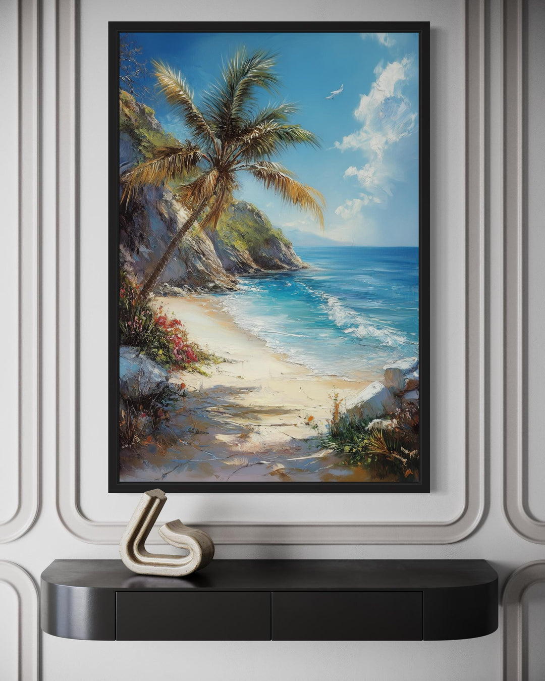 Palm tree with ocean view and tropical beach framed canvas wall art hanging above a black console.