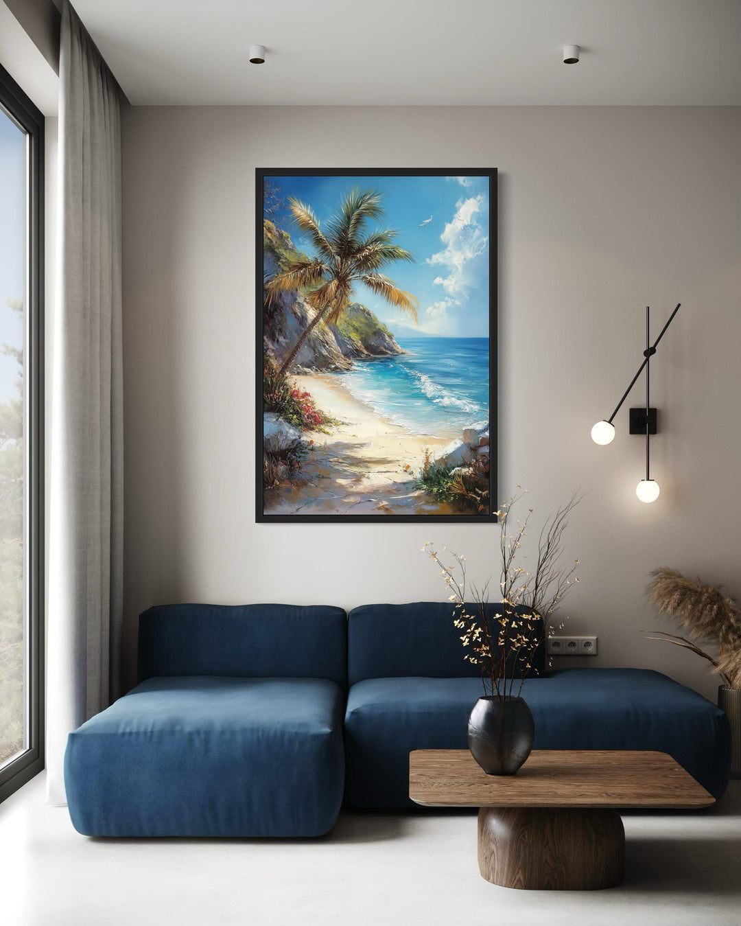 Palm tree with ocean view and tropical beach framed canvas wall art above a blue sofa.
