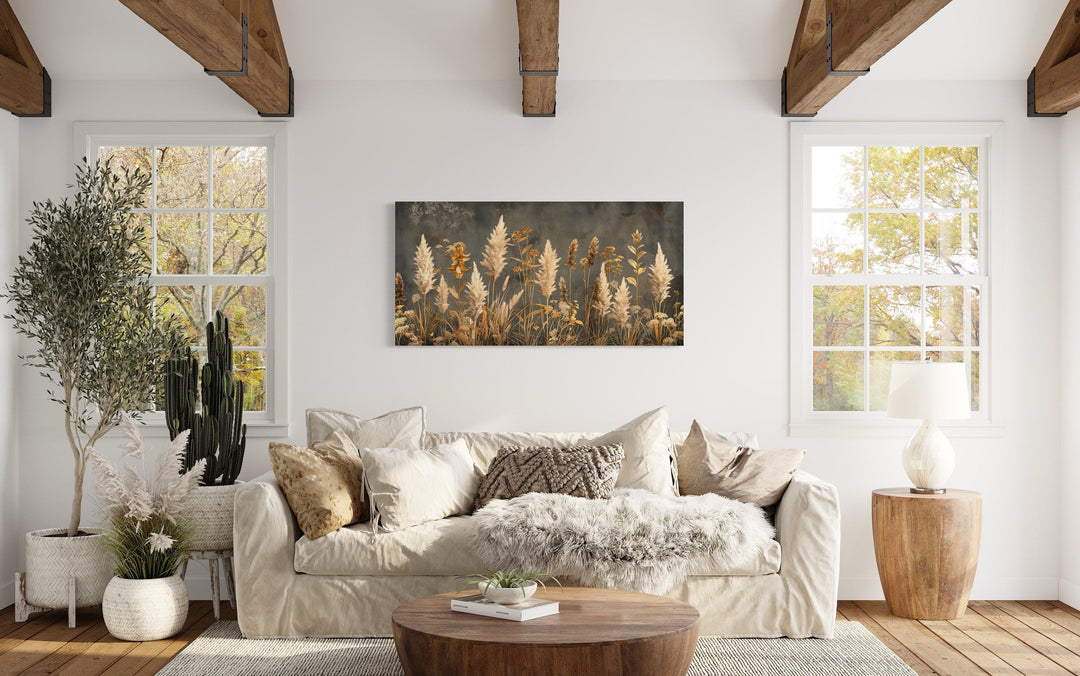 Pampas grass on grey background rustic neutral framed canvas wall art above a beige sofa.