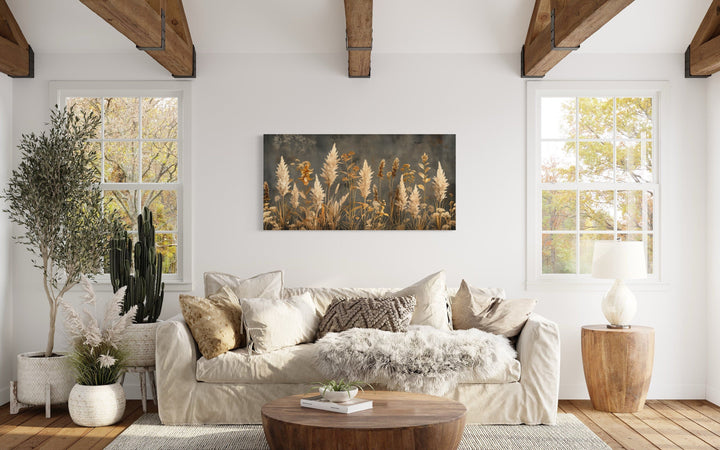 Pampas grass on grey background rustic neutral framed canvas wall art above a beige sofa.