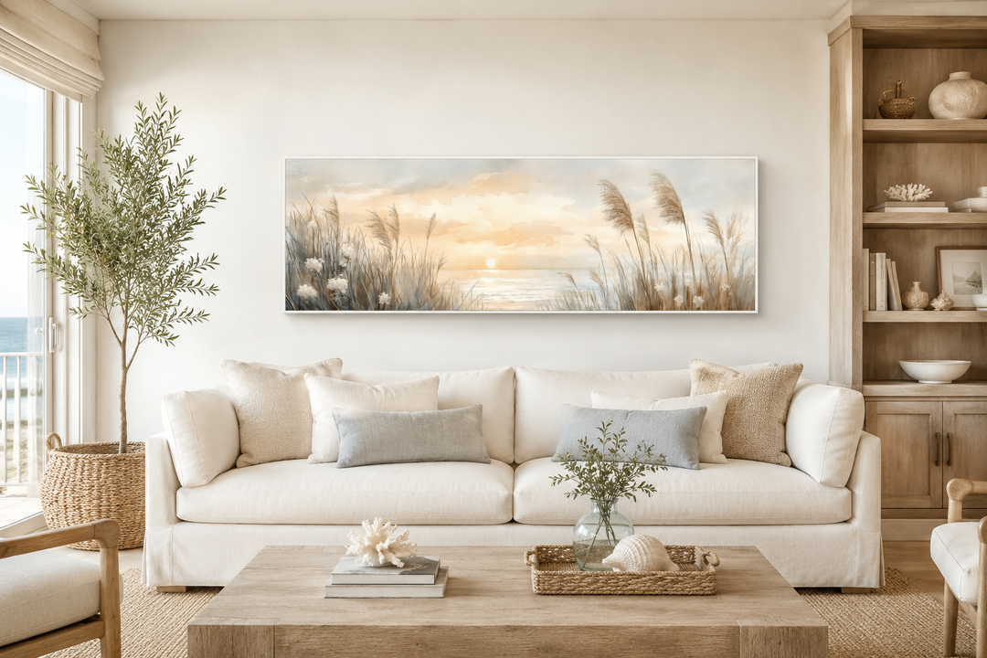 Pampas grass on the beach coastal horizontal wall art hanging above a white sofa in a living room.