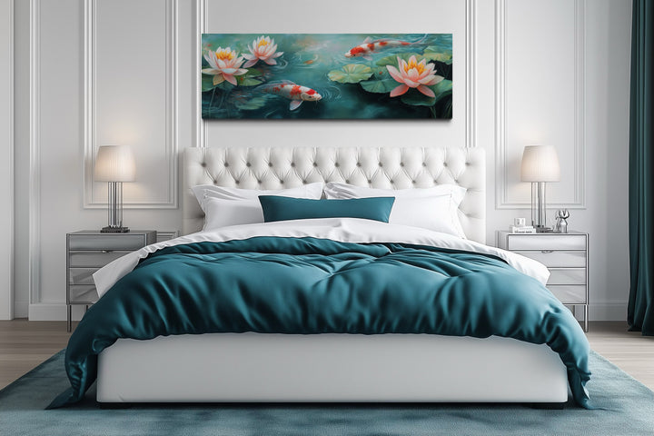 Panoramic koi fish long horizontal framed canvas wall art hanging above a white tufted bed.