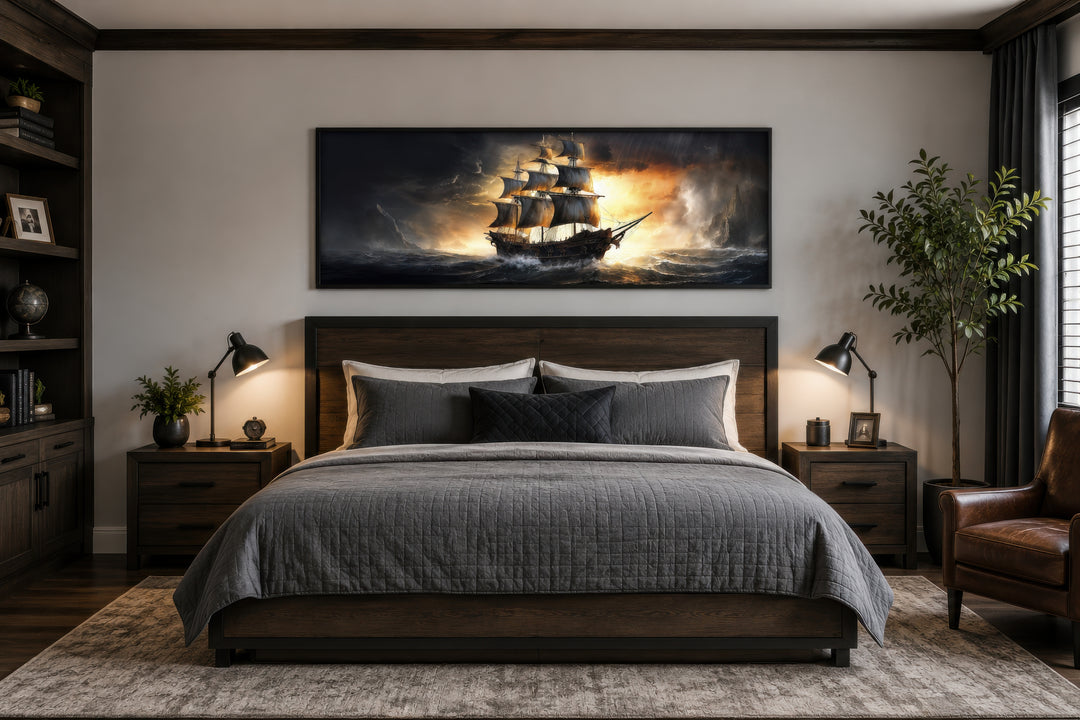 Panoramic framed canvas wall art of a pirate ship in a stormy ocean above a dark wood bed.