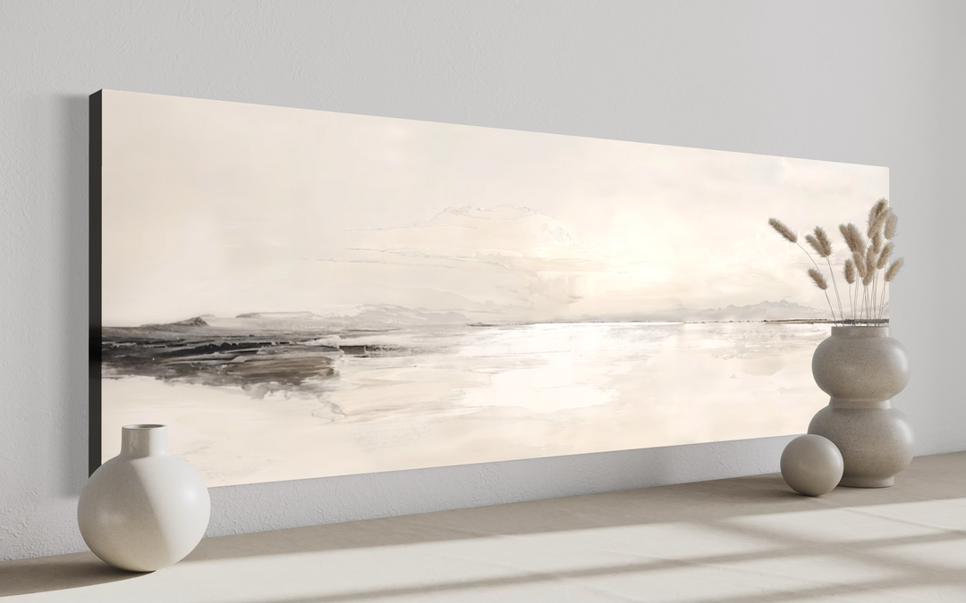Panoramic neutral coastal landscape framed canvas wall art in a minimalist room setting.