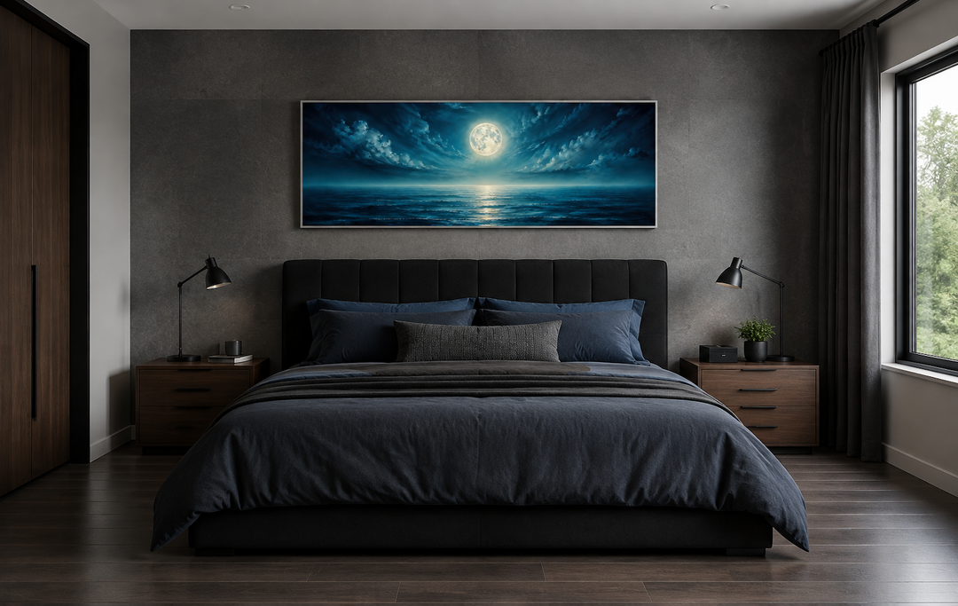 Panoramic navy blue ocean and moon wall art above a dark bed in a modern bedroom.