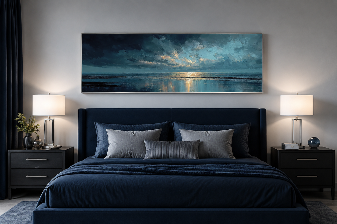 Panoramic ocean wall art with blue, grey, and gold sunset over a bed in a modern bedroom.