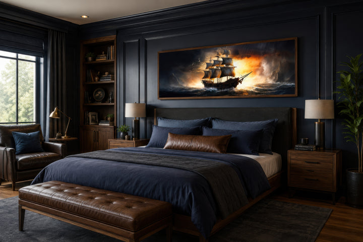 Panoramic framed canvas wall art of a pirate ship in a stormy ocean above a bed in a dark bedroom.