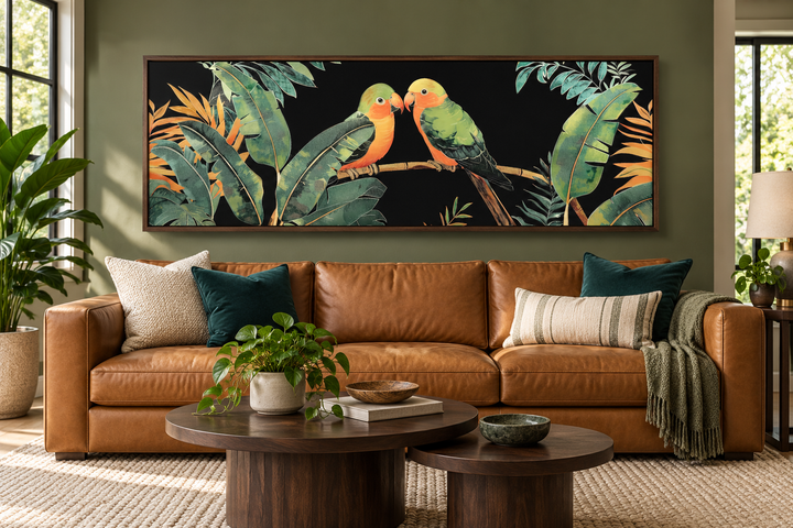 Lovebirds in tropical rainforest long horizontal framed canvas wall art above a leather sofa.