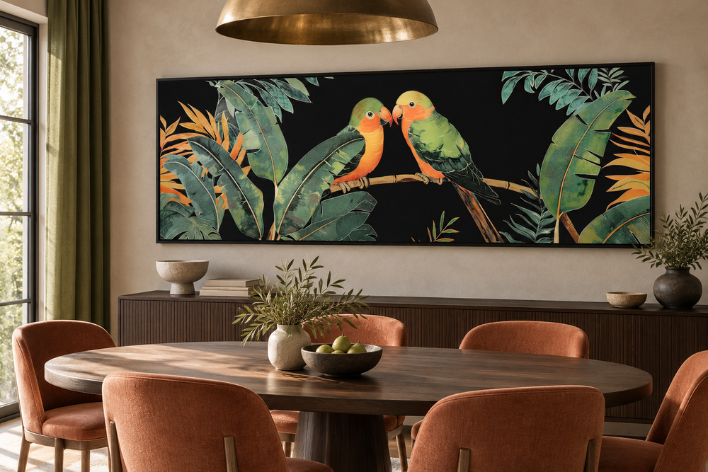 Long horizontal framed canvas wall art of two lovebirds perched among tropical rainforest leaves.