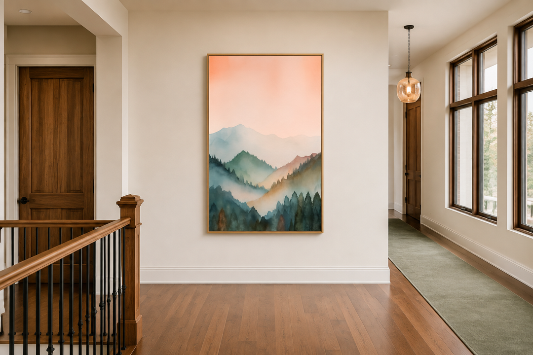 Vertical framed canvas wall art of a pastel mountain landscape in blush pink and green.