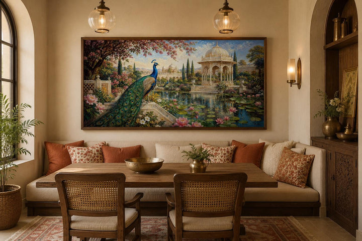 Peacock in Indian Palace Garden canvas wall art hanging above a dining nook with warm lighting.