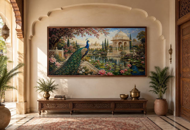 Peacock in Indian palace garden canvas wall art hanging above a wooden console in a living room.
