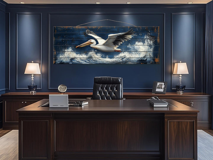 Long horizontal wood wall art featuring a pelican flying over ocean waves in a nautical style.