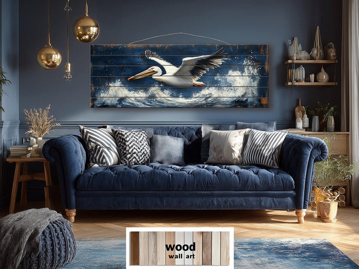 Long horizontal wood wall art featuring a pelican flying over ocean waves in a nautical style.