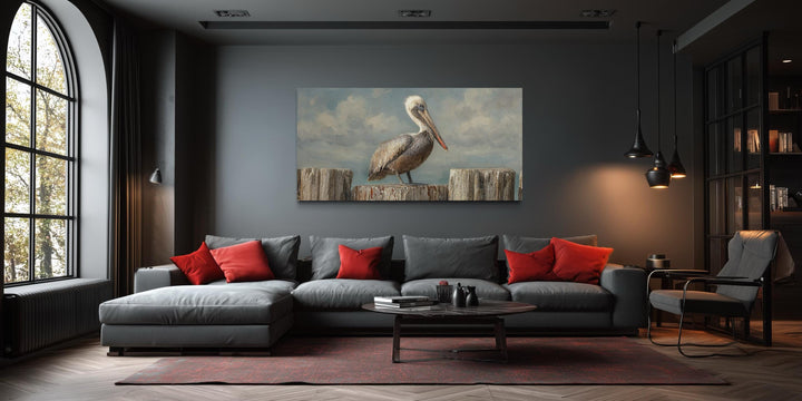 Horizontal coastal canvas wall art featuring a pelican on wooden posts in a modern living room.