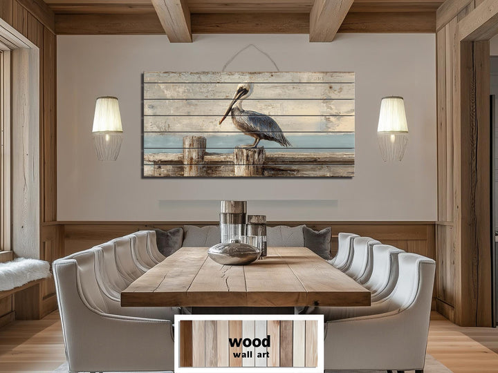 Pelican on a wooden dock coastal wall art printed on distressed wood planks in a dining room.
